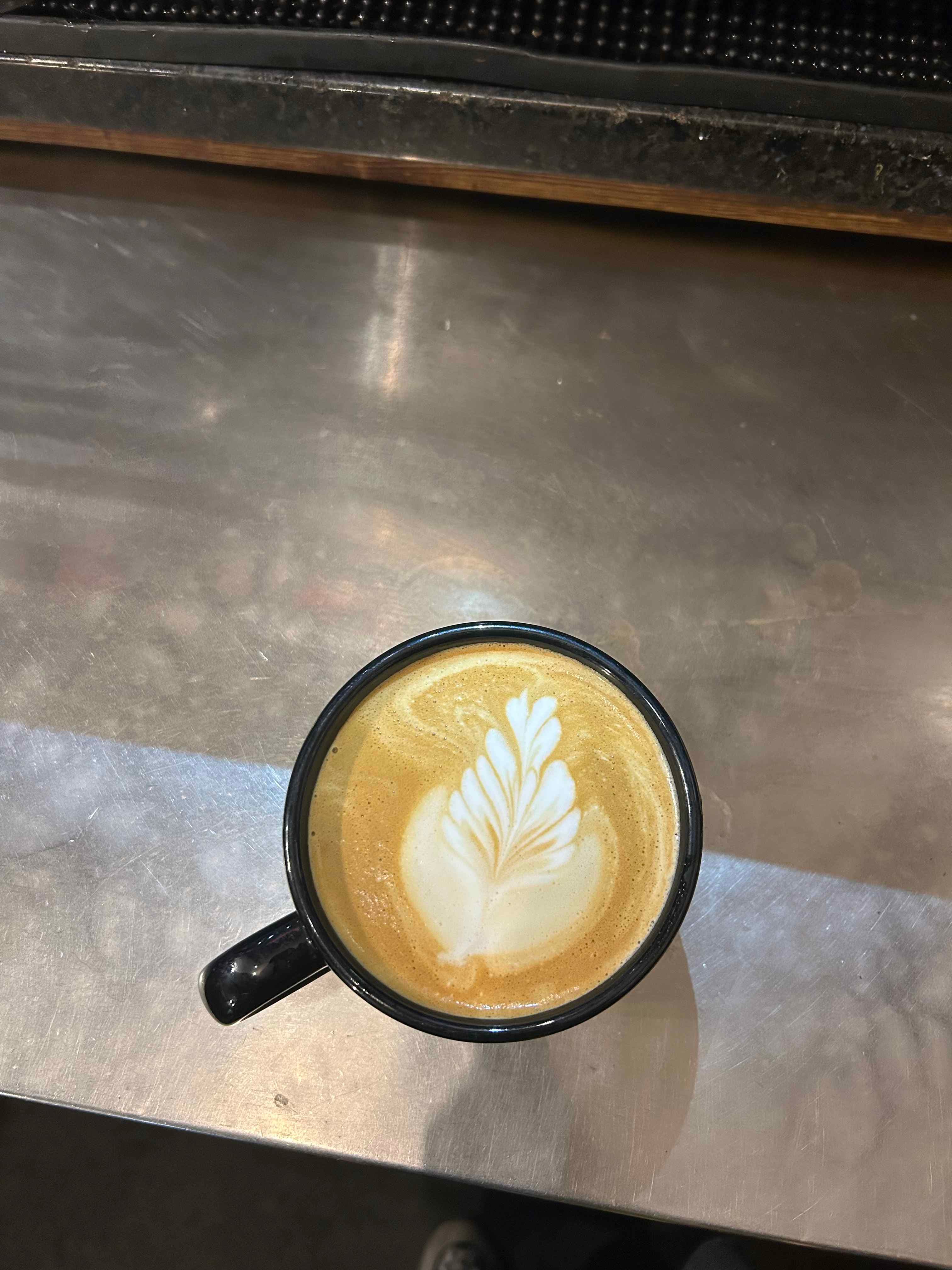 Latte with a poured rosetta in the foam
